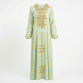 Mint and gold printed abaya ghost image matched to the model's straight silhouette and colour