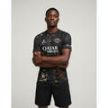 Nigerian male model wearing PSG x Jordan fourth black gold jersey