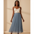 Nigerian woman wearing dusty blue pearl hem pleated midi skirt - front view