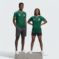 Nigerian male and female models wearing the Unisex Green Aztec Graphic Football Jersey side by side
