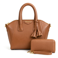 Tan brown twin-handle handbag with tassel details pictured with matching zip wristlet