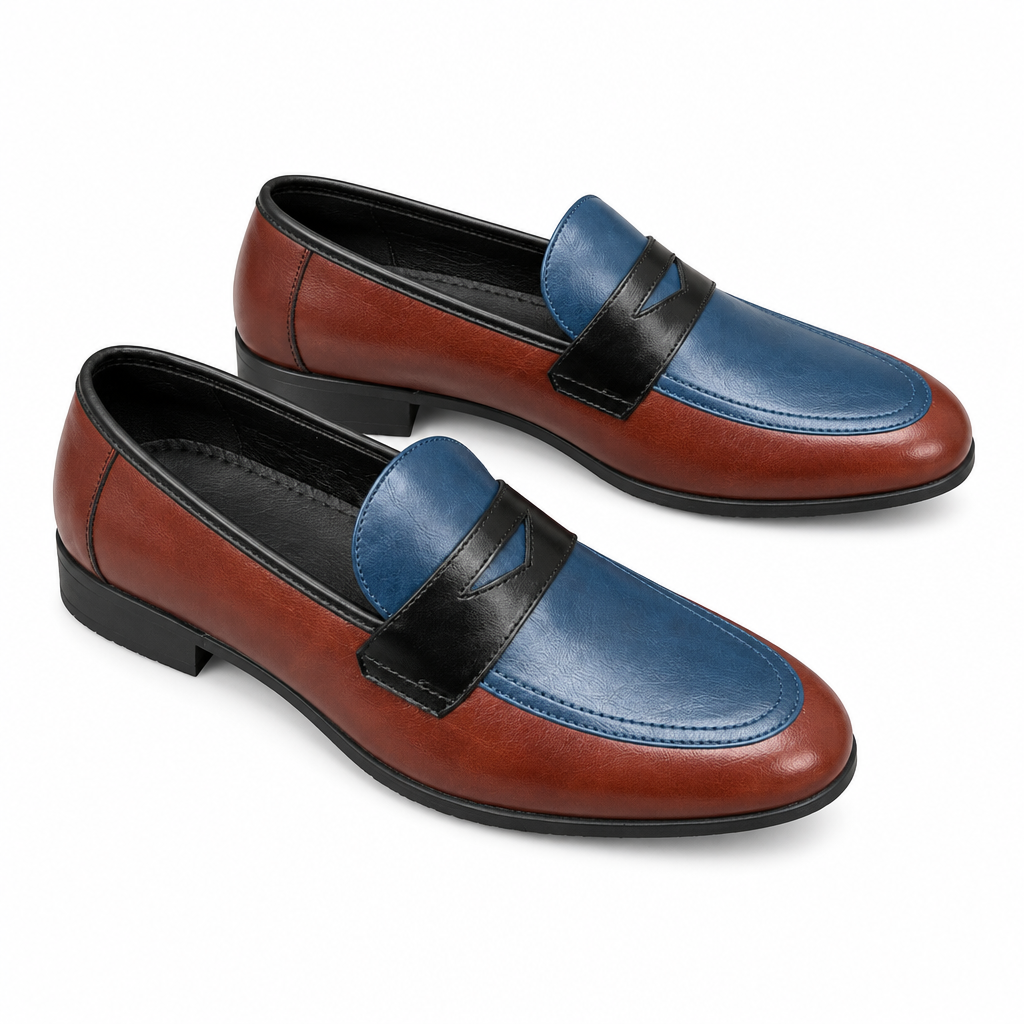 Pair of chestnut and navy two-tone penny loafers on white