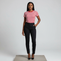 Nigerian female model wearing red and white stripe fitted top with black trousers