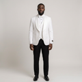 Full-body Black adult model wearing a white shawl-collar suit jacket with black trousers and black formal shoes