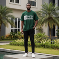 Nigerian male model wearing men's dark green gothic text graphic short-sleeve tee full body streetwear editorial shot