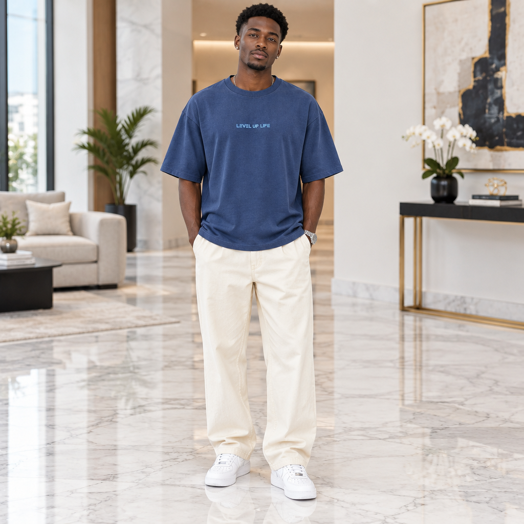 Man wearing denim blue oversized slogan tee