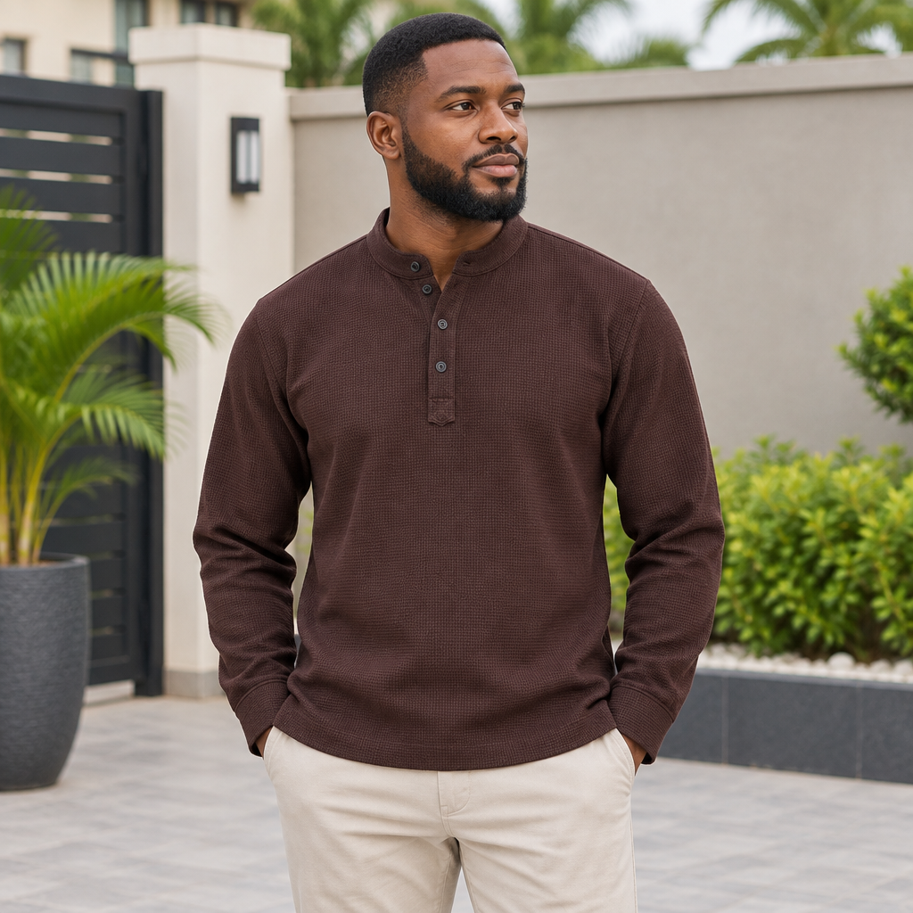 Black Nigerian adult model wearing a brown textured long-sleeve pullover