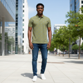 Young Nigerian male model wearing olive green crest emblem print polo shirt
