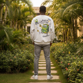 Nigerian male model wearing light grey sweatshirt with green monster cartoon back graphic – back view