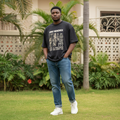 Men's Black Oversized Vintage Concert Graphic Tee – Nigerian Male Model Shot