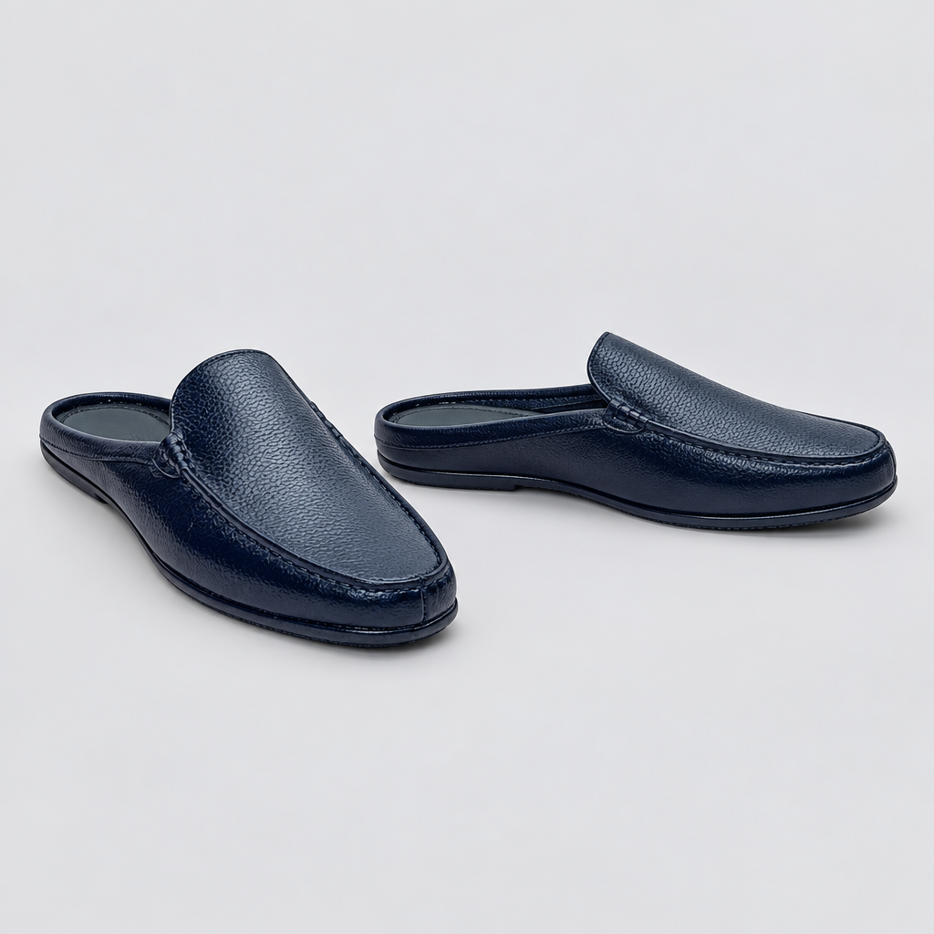 Men's navy blue pebble grain backless mule slippers, front and side view