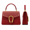 Red pearl-embellished structured women’s handbag shown from the front and side