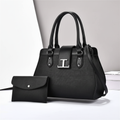 Black structured tote bag set with clutch and card holder on white background