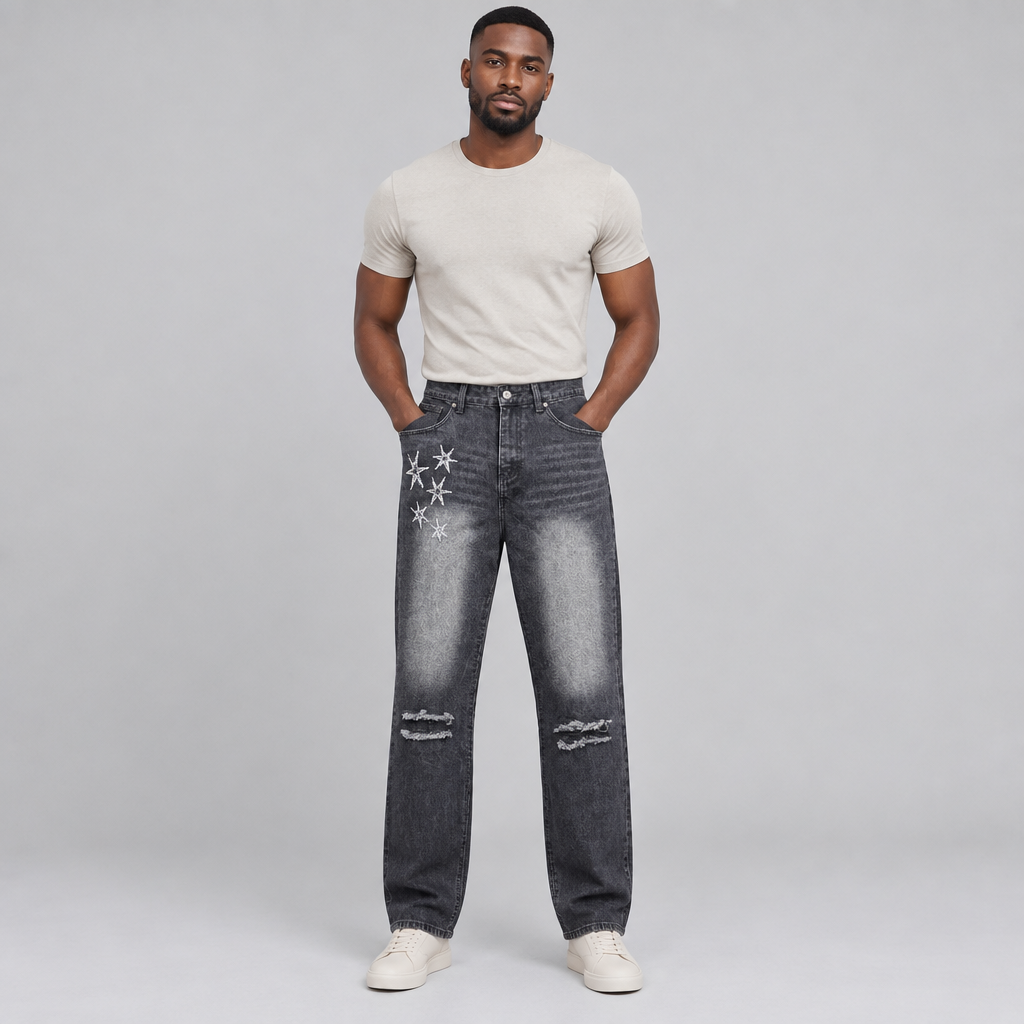 Black Nigerian man wearing charcoal star-detail distressed jeans