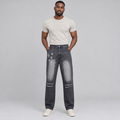 Black Nigerian man wearing charcoal star-detail distressed jeans