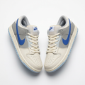 Cream grey and blue low-top sneaker pair on white