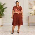 Adult Black woman wearing a rust two-tone buttoned pleated dress