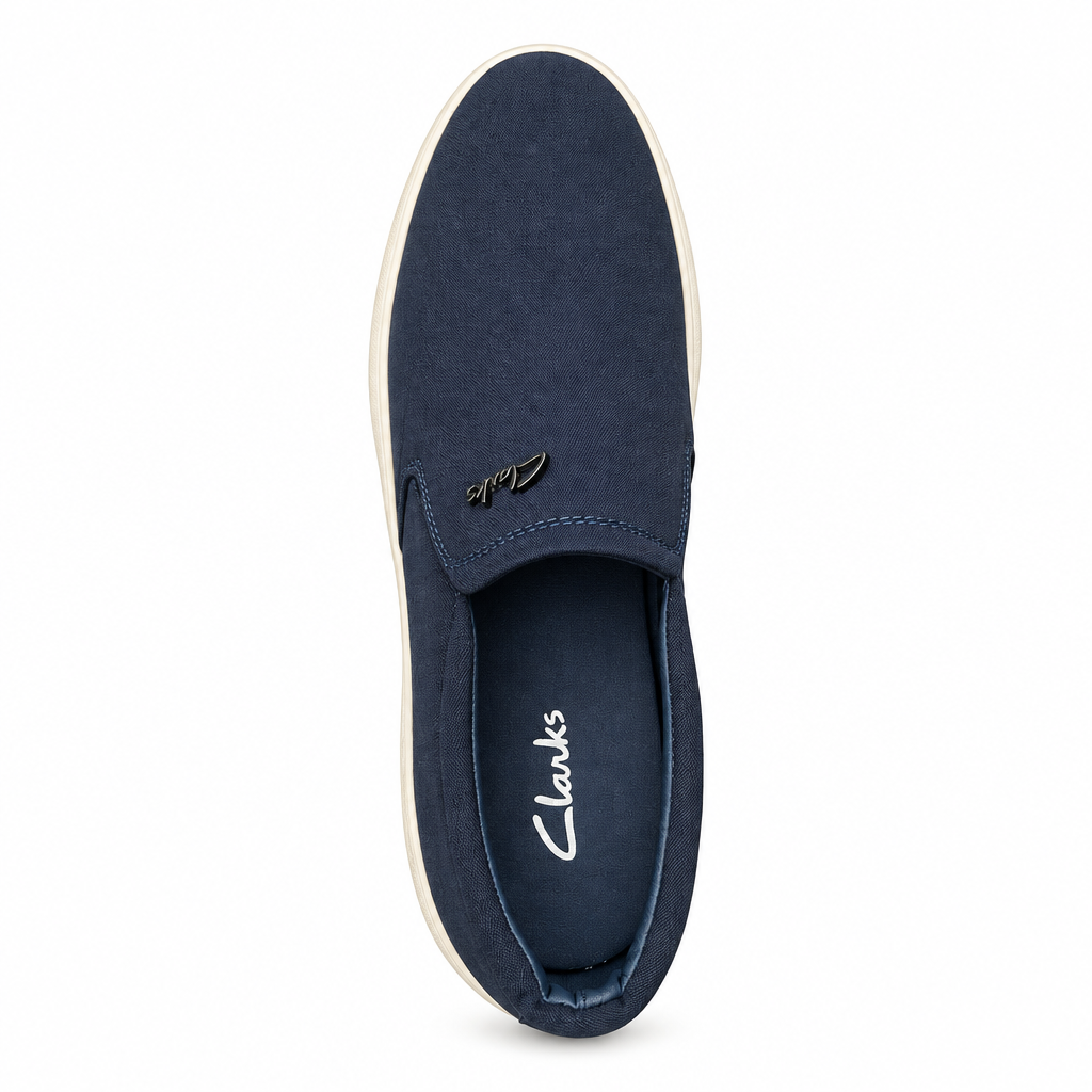 Navy slip-on shoe with a light sole against white