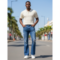 Nigerian model wearing Medium Blue Washed Wide Bootcut Flare Scattered Distress Tear Raw Hem Jeans