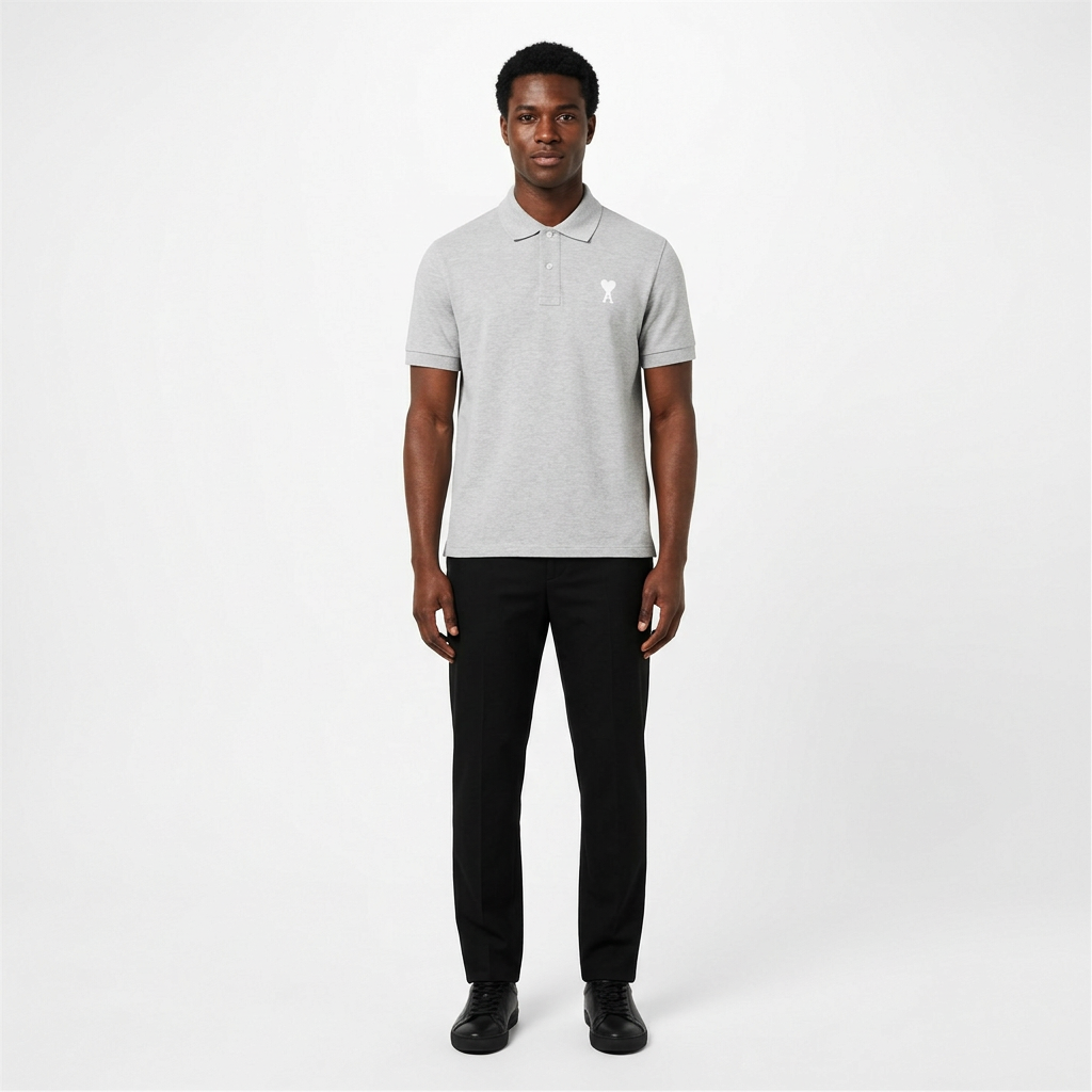 Full-body adult Black man wearing a light-grey white heart-detail polo