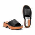 Women's black perforated platform slide sandal with orange sole – ghost mannequin front and side view