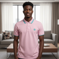 Young Nigerian male model wearing pink teal-tipped polo shirt, front view