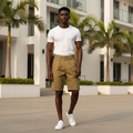 Model wearing olive pleated relaxed-fit shorts