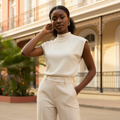 Young Nigerian female wearing cream mock neck ribbed sleeveless top