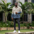 Nigerian male model wearing cream striped slate blue ombré dip-dye workwear shirt — full body street style