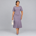 Model wearing mauve asymmetric button midi dress with pleated hem