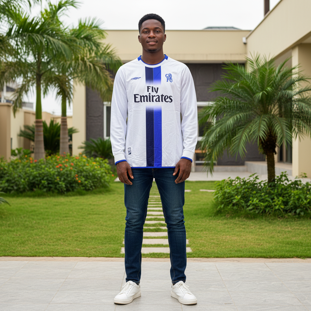 White and navy centre stripe long-sleeve retro football jersey — Nigerian male model front view