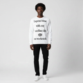 Man wearing the white slogan print long sleeve tee