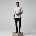 Nigerian male model wearing light grey plain long-sleeved shirt, front view