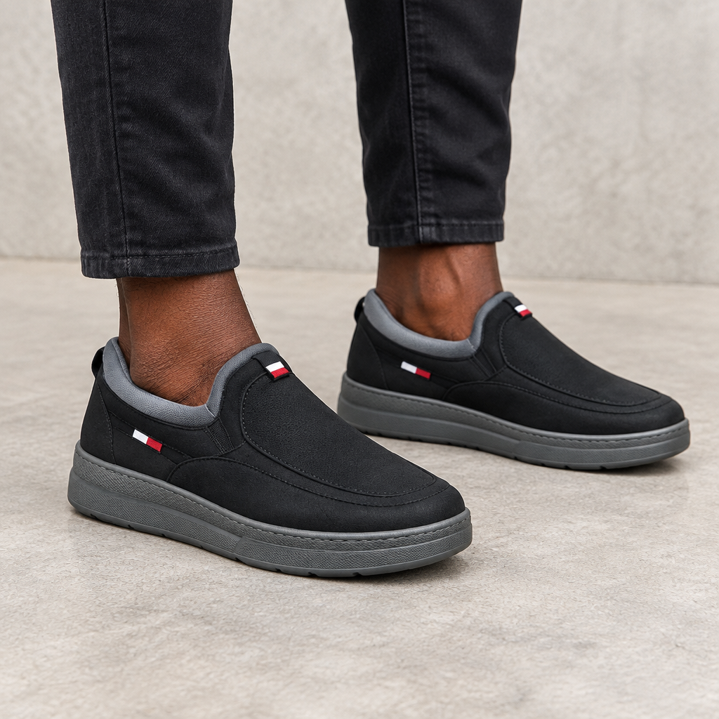 Black grey-collar slip-on shoes worn on both feet