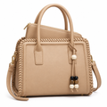 Beige woven-edge handbag with matching inner purse visible above opening