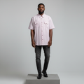 Nigerian male model wearing white pink pinstripe short-sleeved shirt