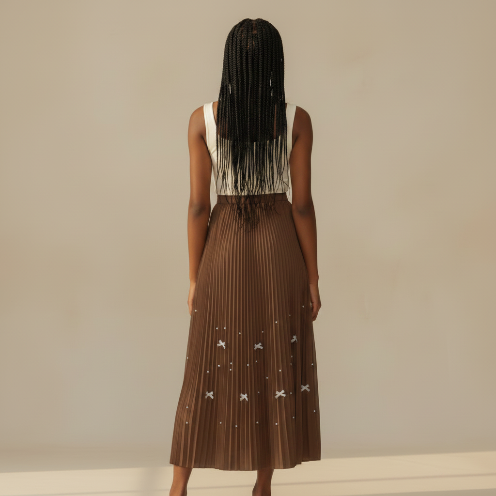 Nigerian girl wearing caramel brown bow pleated midi skirt - back view