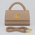 Taupe beige embossed top-handle handbag with matching strap