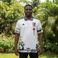 White ink-wash landscape polo collar football jersey on Nigerian male model