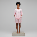 Nigerian female model wearing pink rhinestone top and shorts set