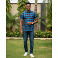 Young Nigerian male wearing electric blue and dark brown windowpane check short sleeve shirt