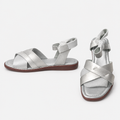Silver cross-strap flat sandals, pair views