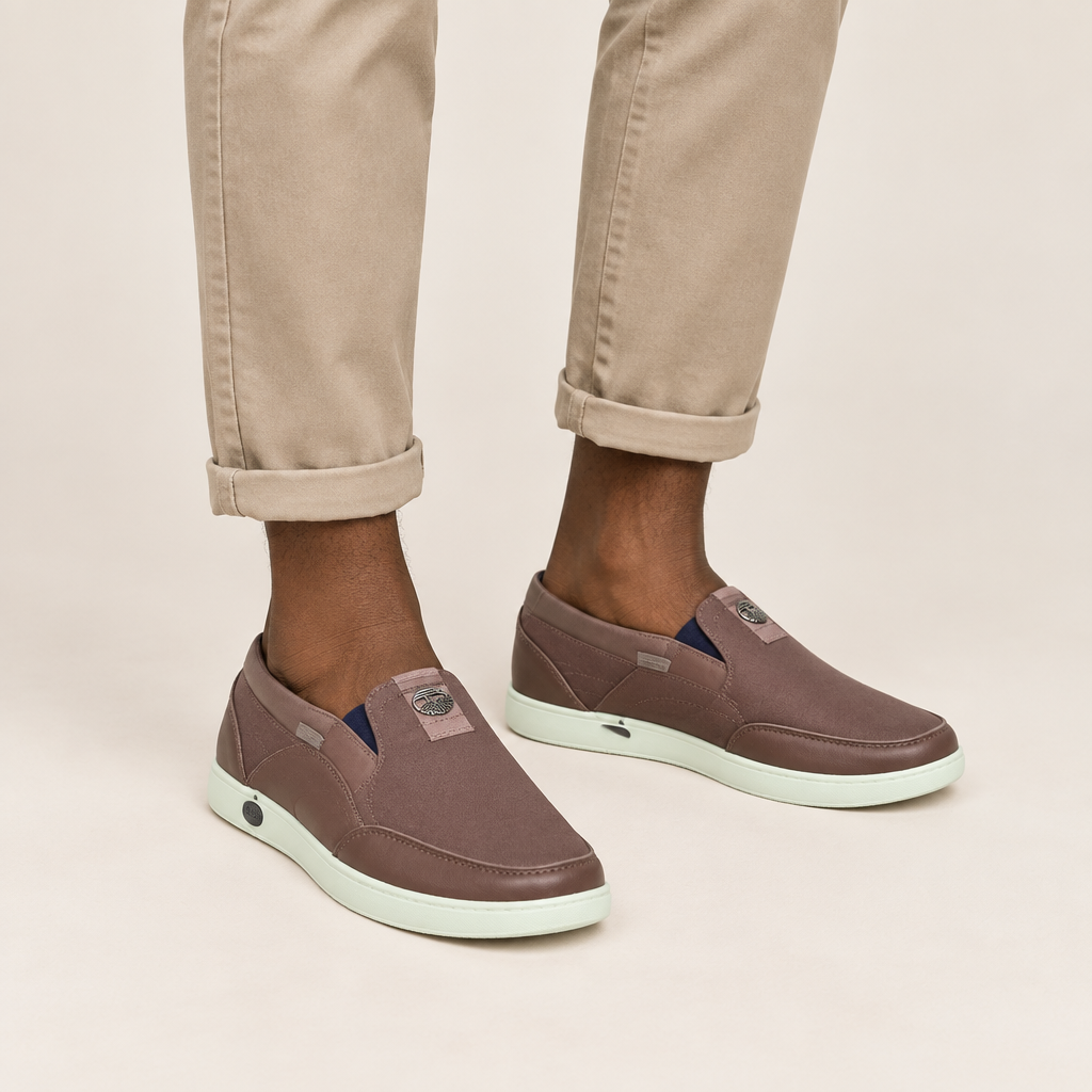 Brown slip-on shoes worn with casual trousers
