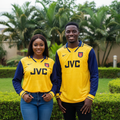 Nigerian female and male models wearing the yellow and navy long-sleeve retro football jersey
