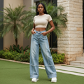 Women's light blue high-waist wide-leg deconstructed panel jeans — Nigerian female model lifestyle shot