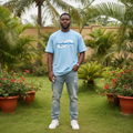 Nigerian male model wearing sky blue orbit swirl graphic tee – front view