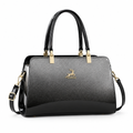Structured charcoal and black women's handbag on white background