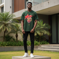 Nigerian male model wearing men's dark green star and balloon graphic short-sleeve tee full body streetwear editorial shot