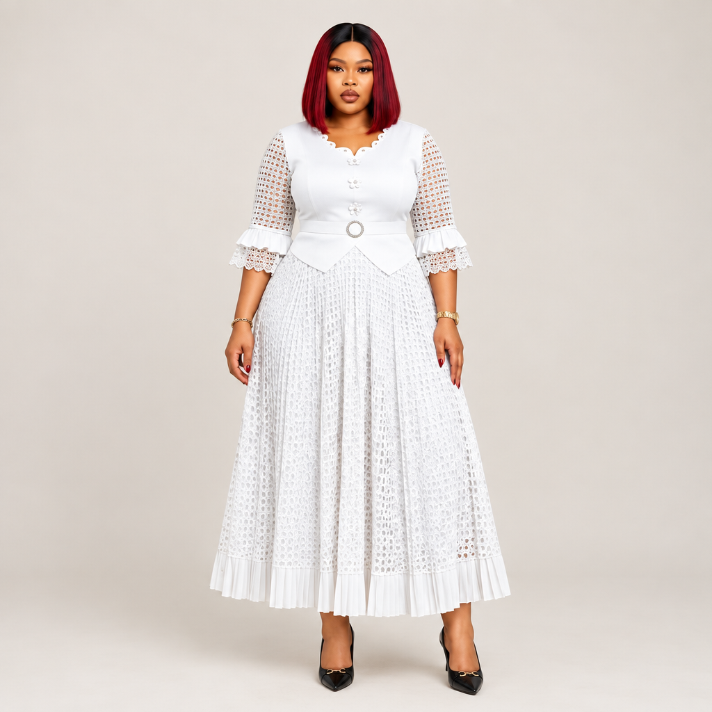 Black Nigerian model wearing a white geometric openwork gown with ruffle sleeves and a belted waist