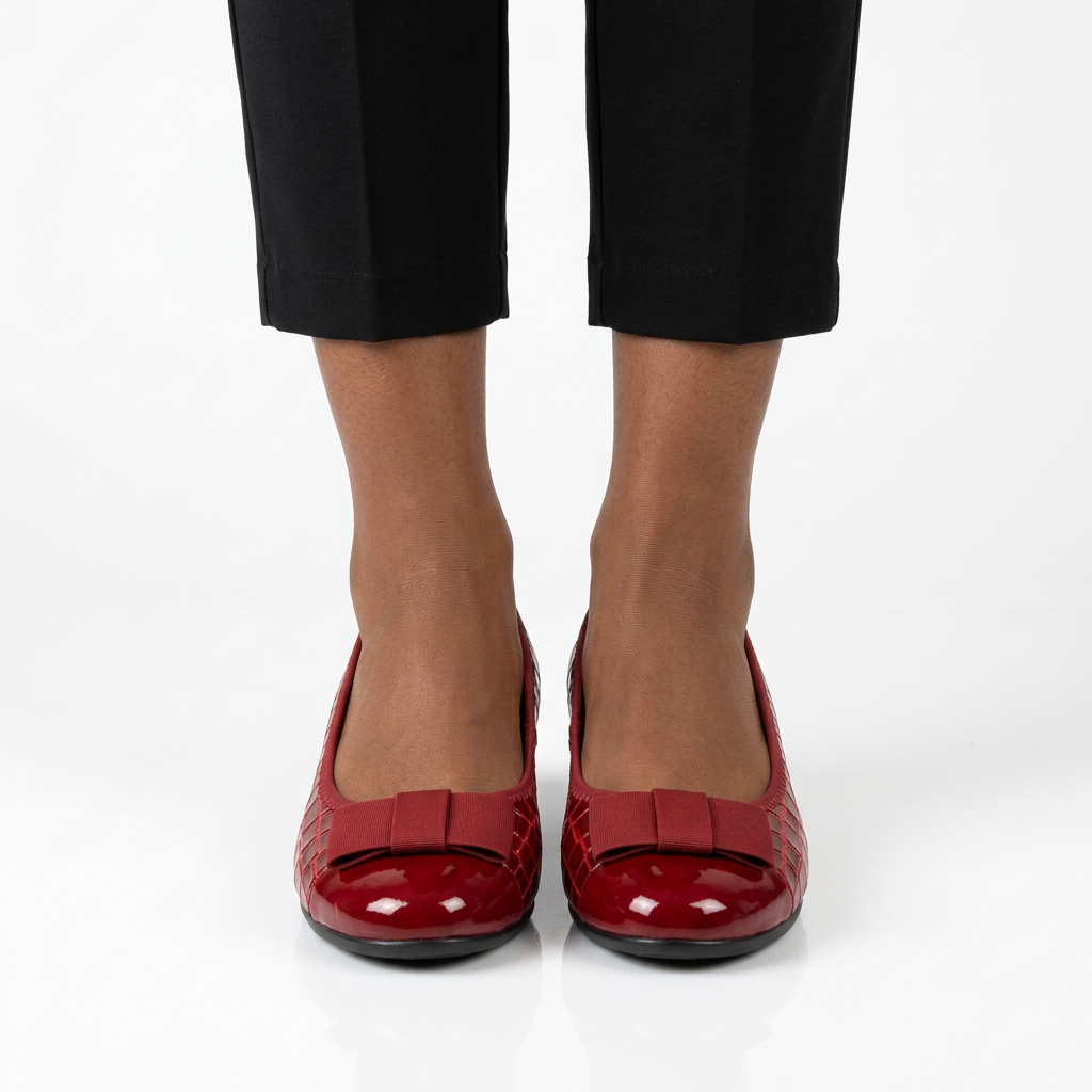 Adult woman wearing red bow wedge shoes with feet together